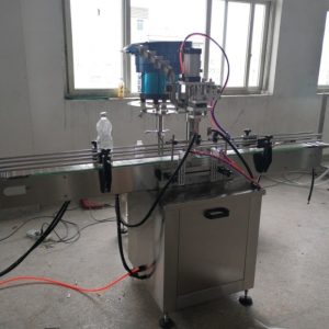 AUTOMATIC PRESS CAPPING MACHINE